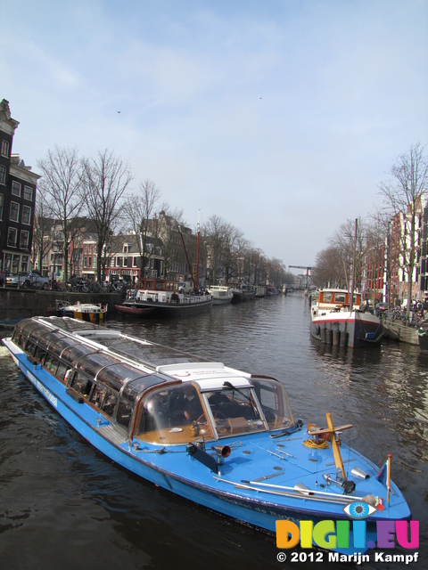 SX21575 Canal boat in Amsterdam canal